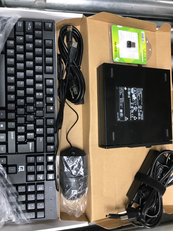 Photo 1 of black wired keyboard and mouse with small motor 