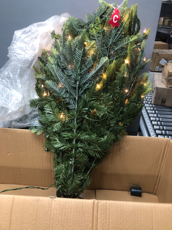 Photo 2 of ***USED - POSSIBLY MISSING PARTS - SOAKED IN WATER***
Puleo International 6.5 Foot Pre-Lit Aspen Fir Artificial Christmas Tree with 500 UL Listed Clear Lights