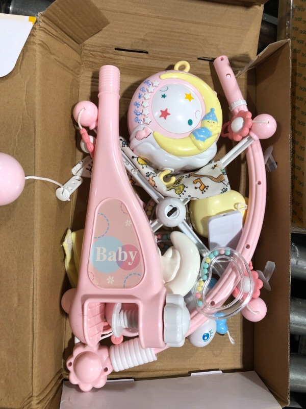 Photo 3 of BOBXIN Baby Musical Crib Mobile with Projector and Night Light,150 Music,Timing Function,Take Along Mobile Music Box and Rattle,Gift for Toddles(with Bibs) pink