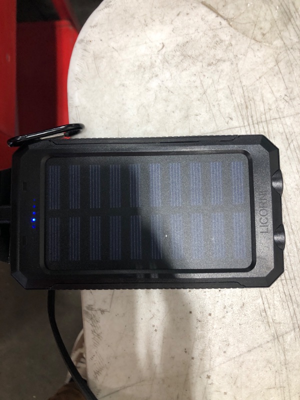 Photo 1 of Solar Powered Charger - Power Bank - Flash Light 