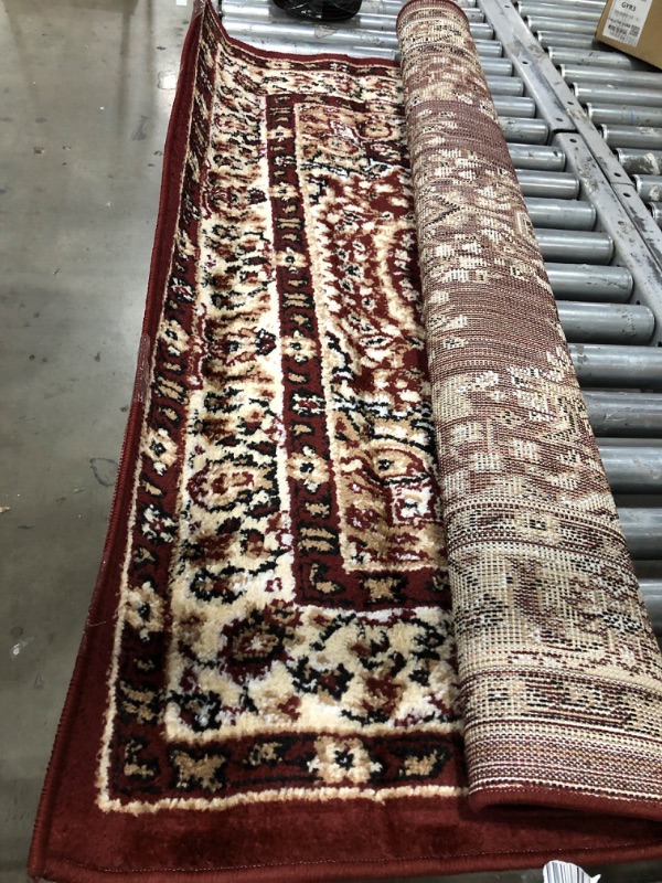 Photo 1 of 4' X 6' BURGUNDY AREA RUG 