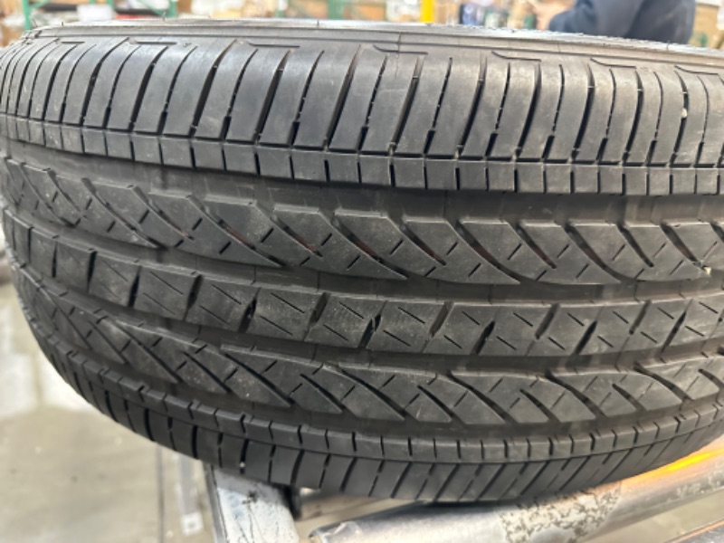 Photo 2 of **MINOR DAMAGE SEEMS USED STILL FUNCTIONAL**
Bridgestone Alenza 001 Performance SUV Tire 245/50R19 105 W Extra Load