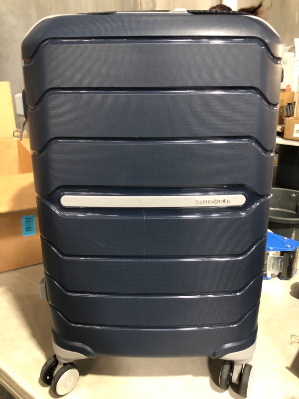 Photo 2 of * item has scratches on it * zipper broken * 
Samsonite Freeform Hardside Expandable with Double Spinner Wheels, Carry-On 21-Inch, Navy Carry-On 21-Inch Navy