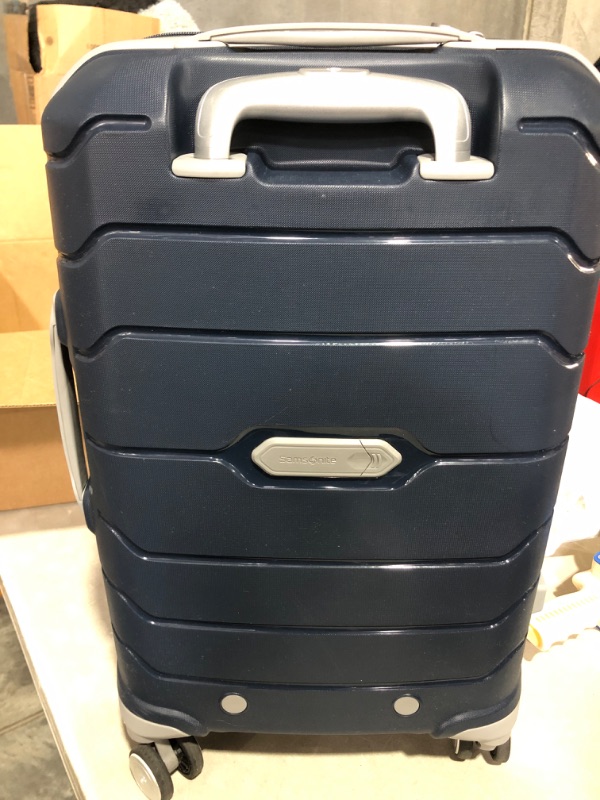 Photo 3 of * item has scratches on it * zipper broken * 
Samsonite Freeform Hardside Expandable with Double Spinner Wheels, Carry-On 21-Inch, Navy Carry-On 21-Inch Navy