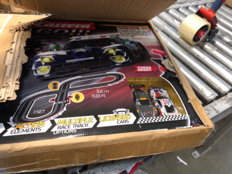 Photo 2 of Carrera GO!!! 62521 onto The Podium Electric Powered Slot Car Racing Kids Toy Race Track Set Includes 2 Hand Controllers and 2 Cars in 1:43 Scale