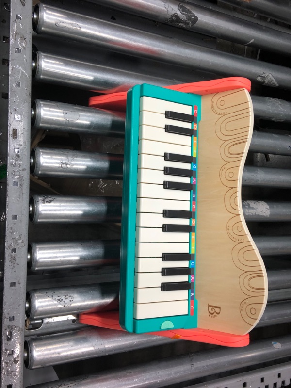 Photo 2 of B. toys wooden toy piano with songbook, piano wooden toy, music toy, musical instrument to learn to play the piano for children from 3 years old.