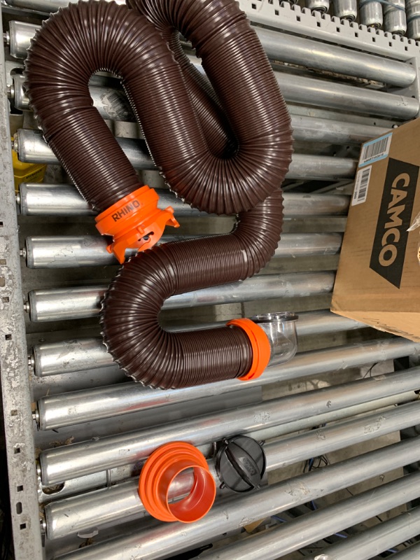 Photo 2 of Camco RhinoFLEX RV Sewer Hose Kit with Swivel Transparent Elbow and 4-in-1 Dump Station Fitting, Brown, 15 Feet (39770) 15ft Sewer Hose Kit Frustration-Free Packaging