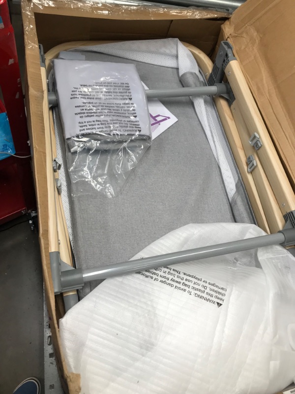 Photo 2 of Boppy Bassinet with Wipeable Mattress Pad and Two Mattress Covers Included, Featuring Anti-tilt Anchors and Mesh Sides, Lightweight and Stores Flat, No Assembly Required, Gray Pickup Sticks