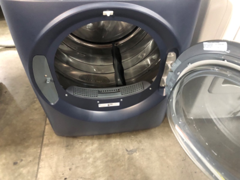 Photo 7 of ***USED - SCRATCHED - POWERS ON - UNABLE TO TEST FURTHER***
GE 7.8-cu ft Reversible Side Swing Door Stackable Steam Cycle Smart Gas Dryer (Sapphire Blue) ENERGY STAR
