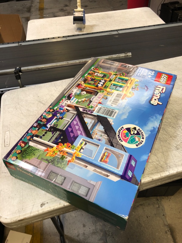 Photo 2 of LEGO Friends Downtown Flower and Design Stores 41732, Buildable Toy Set with Apartment and Shops, Model to Customize, Decorate & Display, Incl. 9 Characters, for Ages 12 Plus (USED, MISSING PIECES