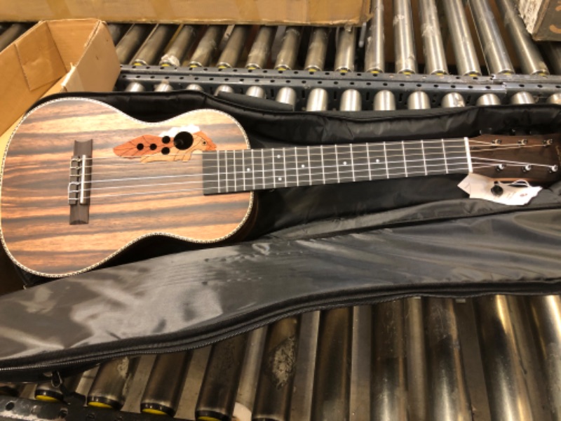 Photo 2 of 30inch Caramel CB904G Ebony Wood Electric Guitalele Small Guitar Kit Beginner Guitarlele Starter Bundle Strings, Padded Gig Bag, Strap and Wall mount Set (Ebony)