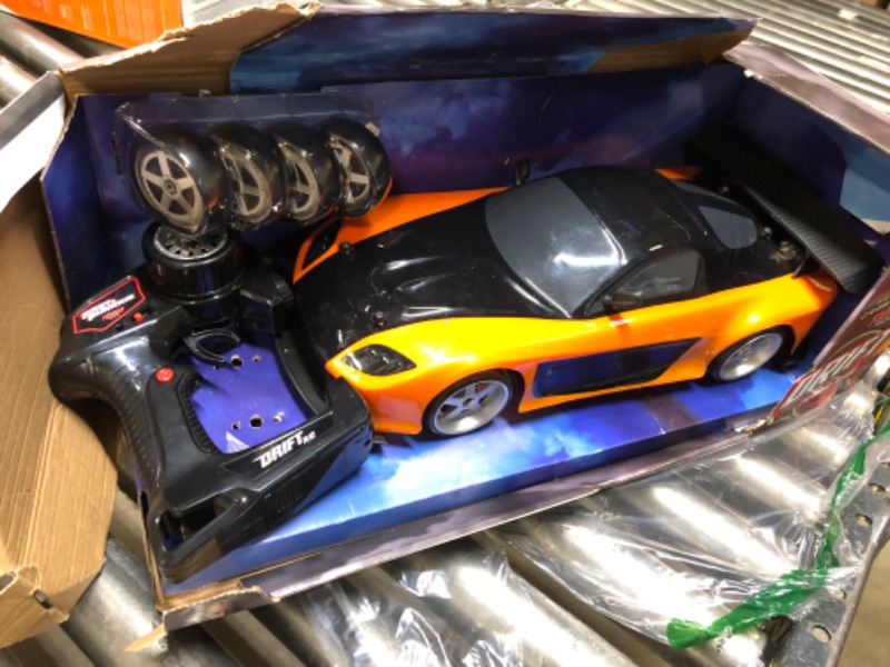 Photo 3 of Jada Toys Fast & Furious Han’s Mazda RX-7 Drift RC Car, 1: 10 Scale 2.4Ghz Remote Control Orange & Black, Ready to Run, USB Charging (Standard) (99700)