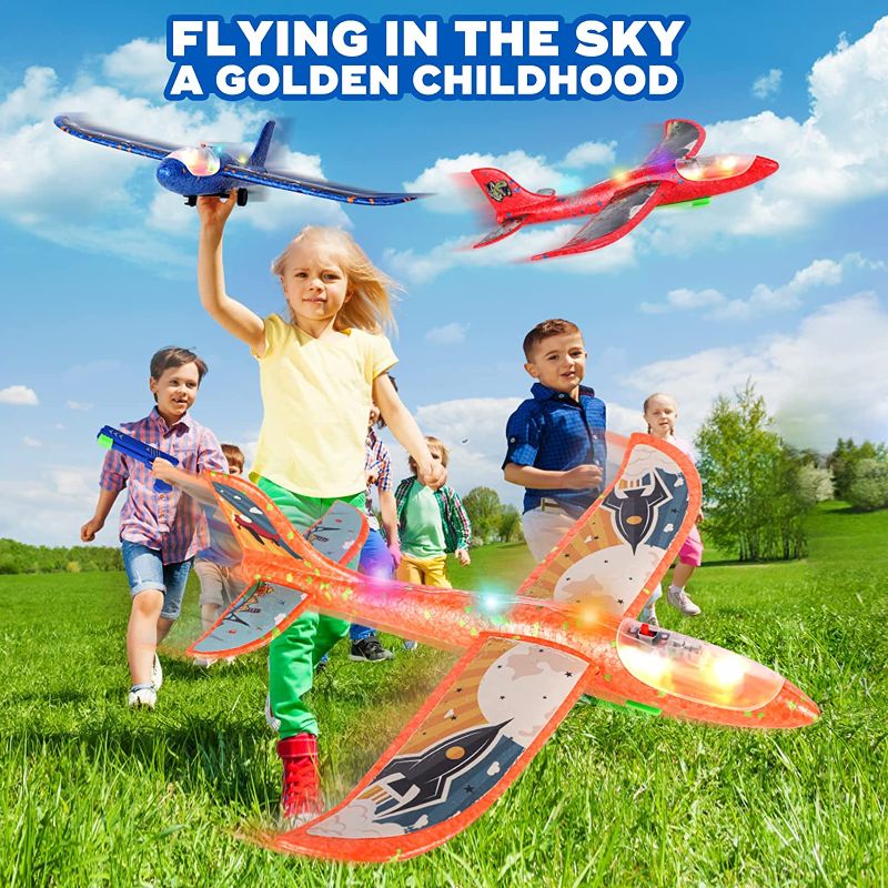 Photo 1 of 2Pack Airplane Launcher Toy, 12.6" Foam Glider Led Plane, 2 Flight Mode Catapult Plane Boy Toys with 3 DIY Stickers, Outdoor Sport Flying Toys for Kids Gifts for 4 5 6 7 8 9 10 12 Year Old Boys Girls
