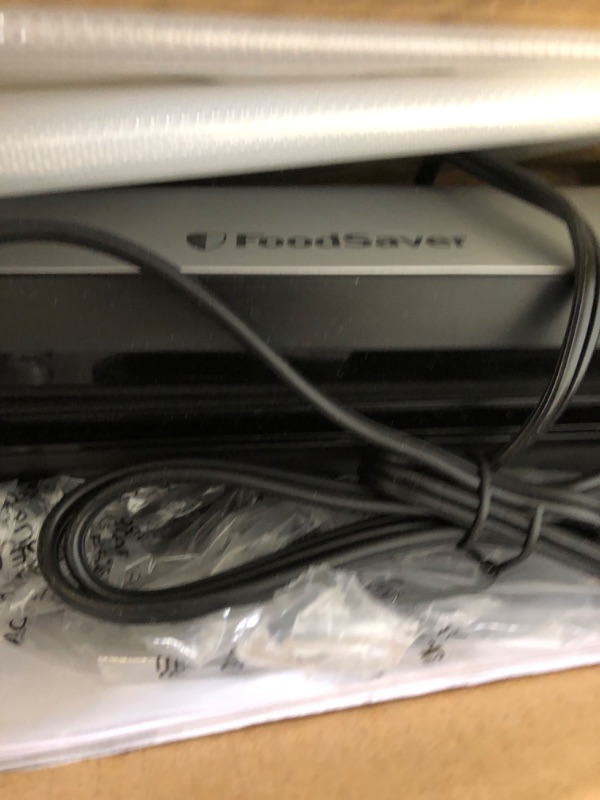 Photo 3 of FoodSaver Space-Saving Vacuum Sealer with Bags and Roll, Silver
