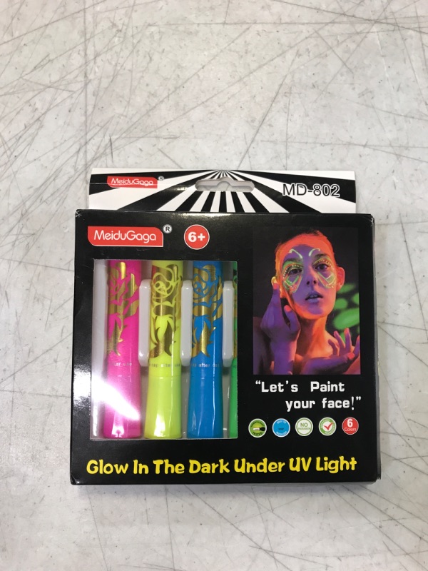 Photo 1 of Glow in The Black Light Face & Body Paint, UV Neon Glow Fluorescent Face Paint Crayons for Halloween Club Makeup Xmas Glow Party
