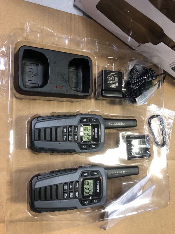 Photo 1 of Uniden SX507-2CKHS Up to 50 Mile Range Two-Way Radio Walkie Talkies W/Dual Charging Cradle, Waterproof, Floats, 22 Channels, 142 Privacy Codes, NOAA Weather Scan + Alert, Includes 2 Headsets, Grey