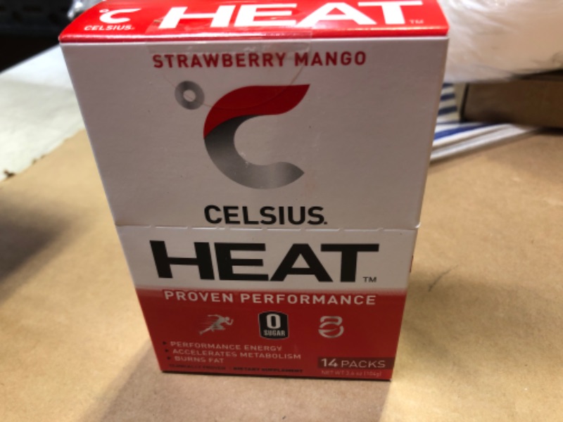 Photo 2 of  exp date 08/2023 ----- CELSIUS FGSS1312 HEAT On-the-Go Performance Energy Powder Stick Packets, Strawberry Mango (Pack of 14) Strawberry Mango 14 Count (Pack of 1)--------exp date  08/2023