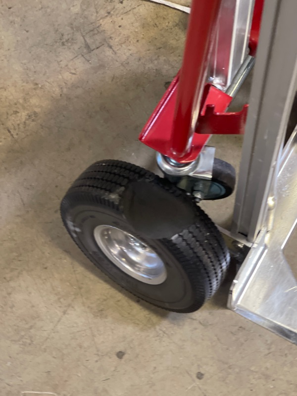 Photo 3 of 1,000 lbs. Capacity 4-in-1 Hand Truck ** WHEEL DENTED INWARDS, CHUNK TAKEN OUT OF TIRE** 
