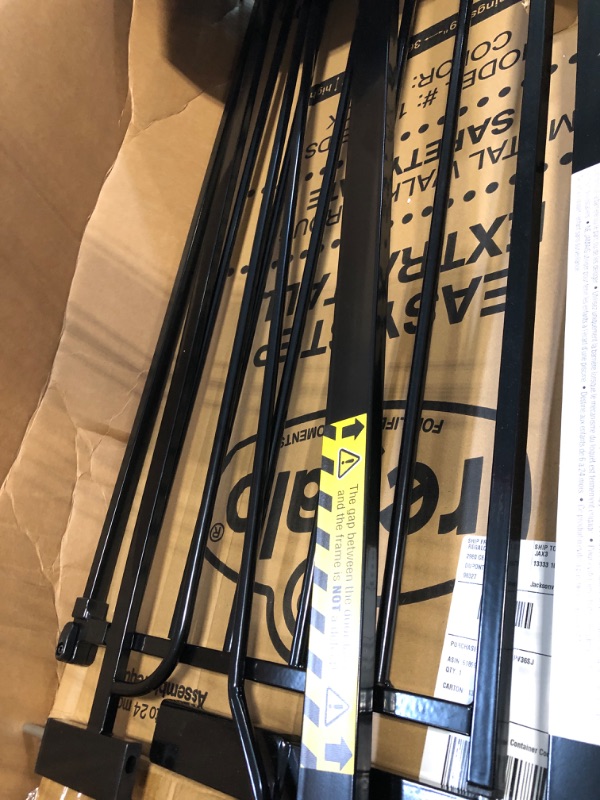 Photo 1 of Regalo Easy Step Extra Tall Walk Thru Baby Gate, Bonus Kit, Includes 4-Inch Extension Kit, Pressure Mount Kit and Wall Cups and Mounting Kit, Black, 4 Count (Pack of 1)