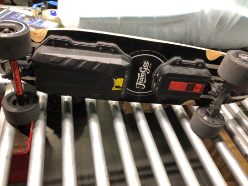 Photo 1 of Teamgee H20mini Electric Skateboard with Remote Control Hub Motors 900W Range 18 Miles 24mph Top Speed 4 Speed Adjustment Load up to 286 Lbs 7 Ply Maple Longboard
