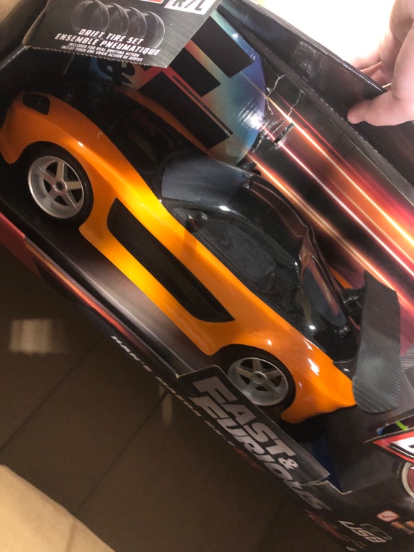 Photo 1 of Jada Toys Fast & Furious Han’s Mazda RX-7 Drift RC Car, 1: 10 Scale 2.4Ghz Remote Control Orange & Black, Ready to Run, USB Charging (Standard) (99700)