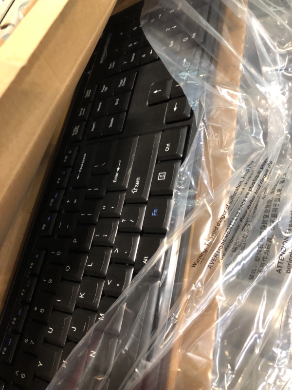 Photo 1 of Amazon Basics Wireless Computer Keyboard and Mouse Combo - Quiet and Compact - US Layout (QWERTY)