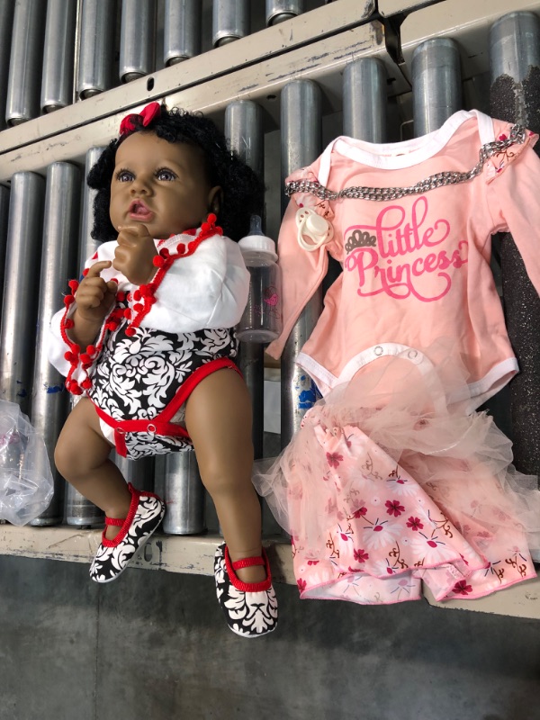 Photo 1 of Aori Reborn Baby Dolls Lifelike Black 22 Inch Realistic African American Newborn Baby Girls That Look Real Body Weighted Soft Body Real Life Toddler Doll Strawberry Gift Set for Ages 3+ Sweet Strawberry