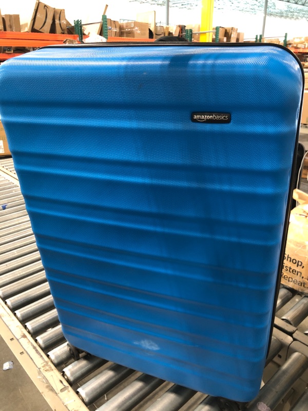 Photo 1 of Amazon Basics 30-Inch Hardside Spinner, Blue Blue 30-inch Spinner