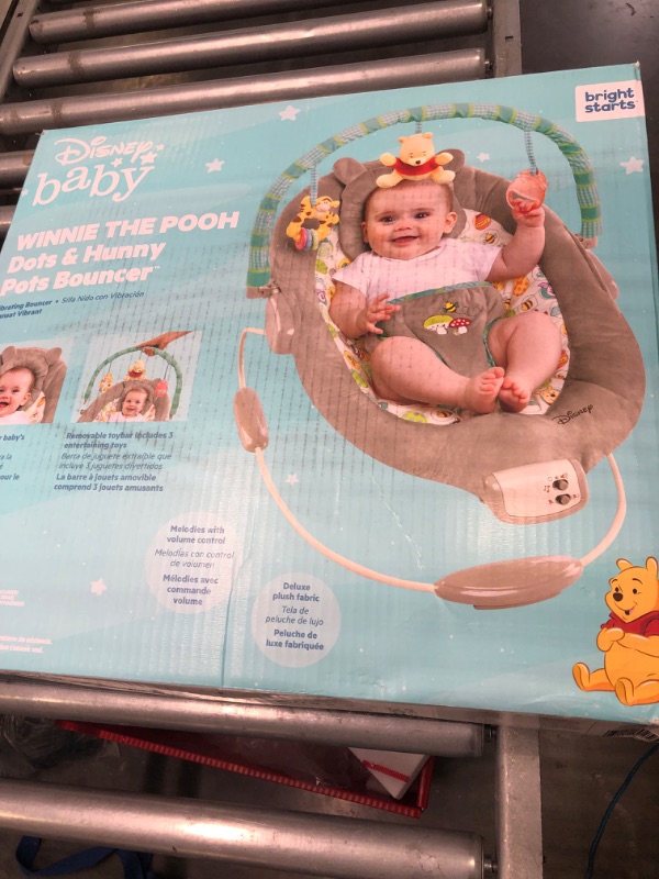 Photo 3 of Bright Starts Winnie the Pooh Dots & Hunny Pots Baby Bouncer with Vibrating Infant Seat, Music & 3 Playtime Toys, 23x19x23 Inch