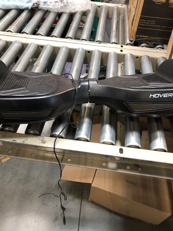 Photo 1 of Hover-1 Superfly Electric Hoverboard, 7MPH Top Speed, 6 Mile Range, Long Lasting Li-Ion Battery, 5HR Full Charge, Built-In Bluetooth Speaker, Rider Modes: Beginner to Expert, Black