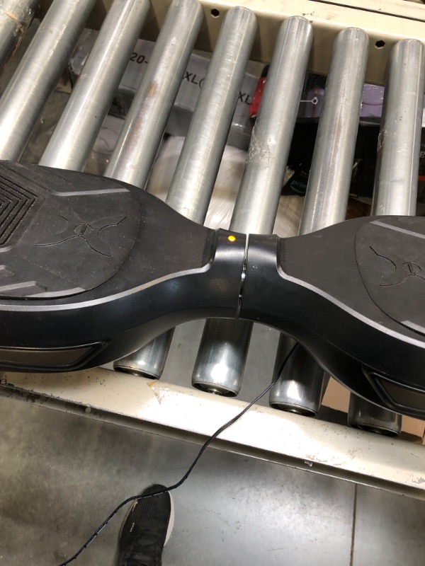 Photo 1 of Hover-1 Superfly Electric Hoverboard, 7MPH Top Speed, 6 Mile Range, Long Lasting Li-Ion Battery, 5HR Full Charge, Built-In Bluetooth Speaker, Rider Modes: Beginner to Expert, Black