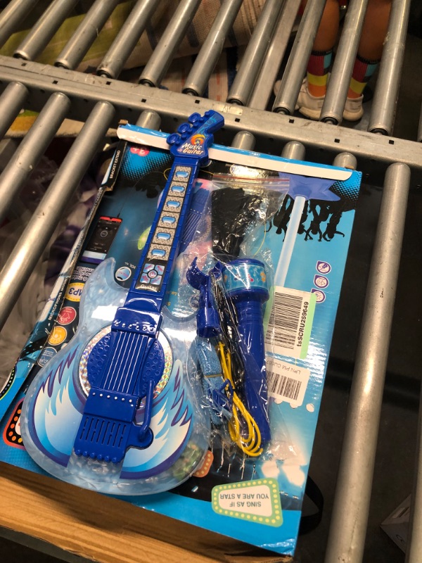 Photo 4 of ackage Included:Contains with 1 electric guitar, 1 speaker microphone, 1 adjustable microphone stand, 1 strap, 1 connection line and 1 screwdriver.This guitar and microphone toy is powered by 3 AA batteries (not included).Perfect for beginners who want to