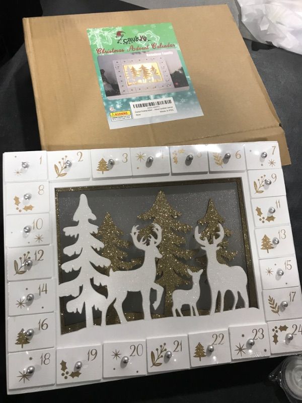 Photo 2 of Zcaukya Christmas Advent Calendar, Pre-lit LED Wooden Reindeer Christmas Advent Calendar with 24 Drawers, 24 Days Christmas Countdown Calendar
