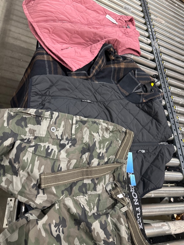 Photo 1 of BOX LOT. WOMEN AND MENS CLOTHING. SIZES VARY. JACKET IS M WOMENS , BLACK VEST XXL MENS, PINK VEST 18 WOMENS, SHORTS MENS 40