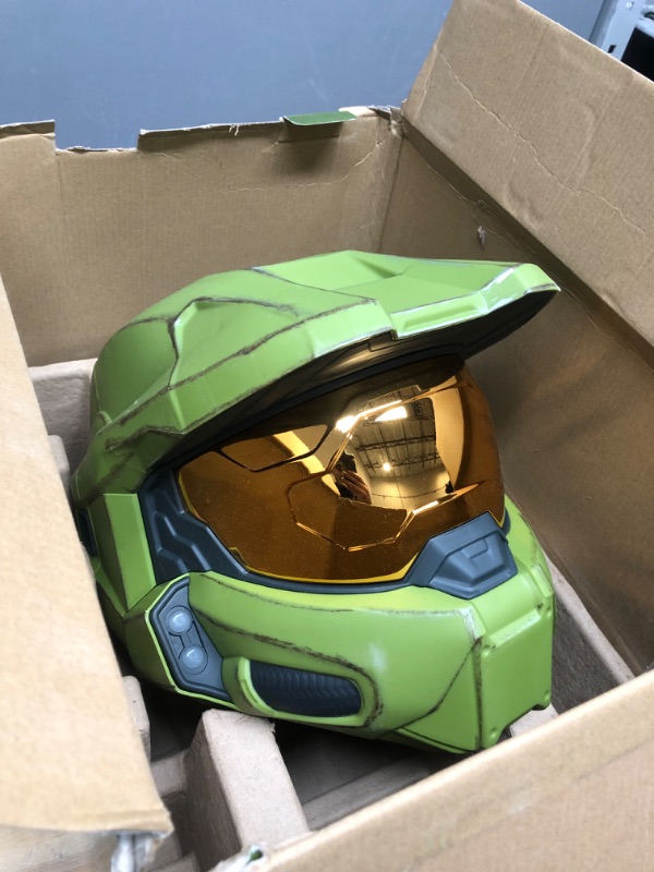 Photo 1 of HALO Master Chief Deluxe Helmet with Stand - LED Lights on Each Side - Battle Damaged Paint - One Size Fits Most - Build Your Halo Universe, Green