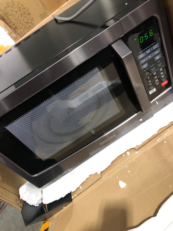 Photo 3 of * used item * powers on * see all images *
toshiba em131a5c-bs microwave oven with smart sensor, easy clean interior