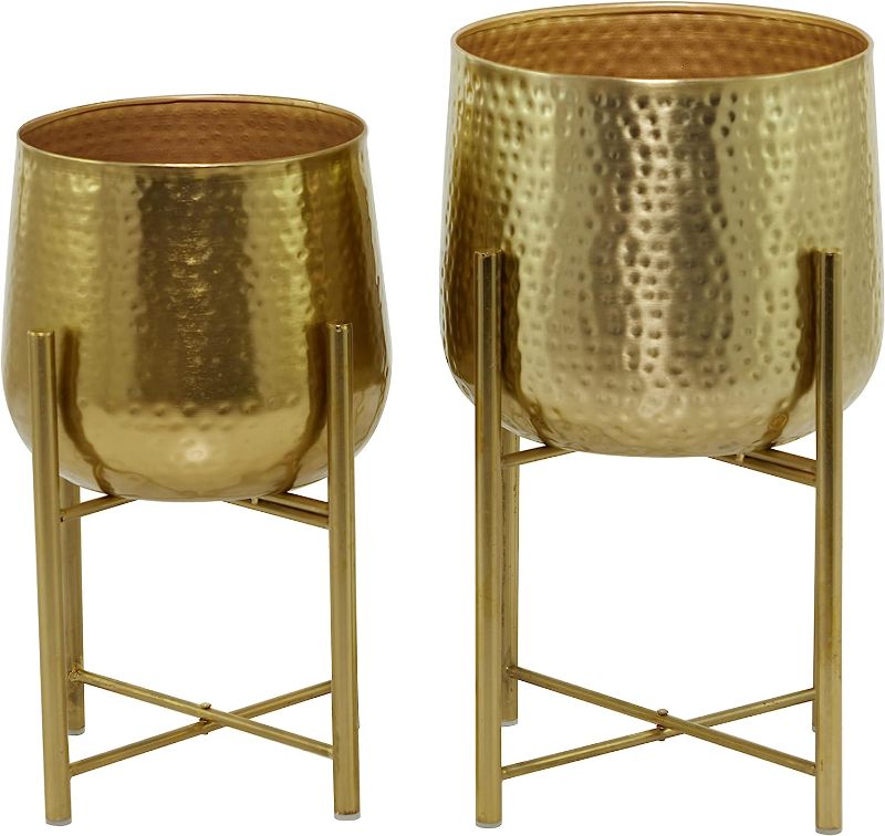 Photo 1 of 
CosmoLiving by Cosmopolitan Metal Round Planter with Removable Stand, Set of 2 17", 19"H, Gold
Size:19", 17"
Color:Gold