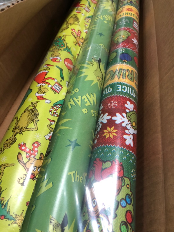 Photo 2 of American Greetings Christmas Wrapping Paper with Cut Lines Bundle, The Grinch (3 Rolls, 105 sq. ft.)