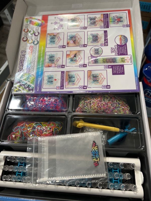 Photo 2 of Rainbow Loom® Bracelet Craft Kit Features Carrying Case, 8 Bracelet Instructions, Display Rack, 1800 Colorful Bands, Make Up to 72 Bracelets for Boys and Girls 7+ Deluxe