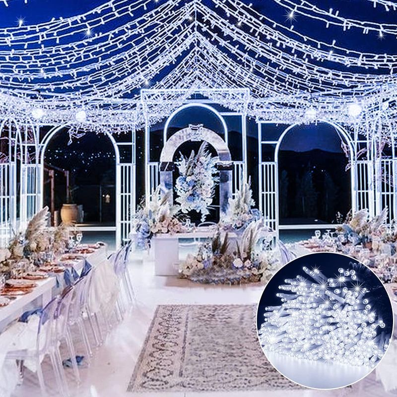 Photo 1 of  600 LED Curtain Wedding String Lights, 20 FT Plug in Fairy String Window Hanging Lights 8 Light Modes Backdrop Lights for Wedding/Indoor/Outside/Bedroom/Wall/Party/Christmas Decorations