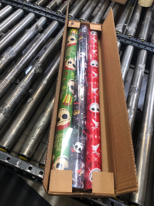 Photo 2 of American Greetings Nightmare Before Christmas Wrapping Paper Bundle with Cut Lines, Jack Skellington and Zero (3 Rolls, 105 sq. ft.)