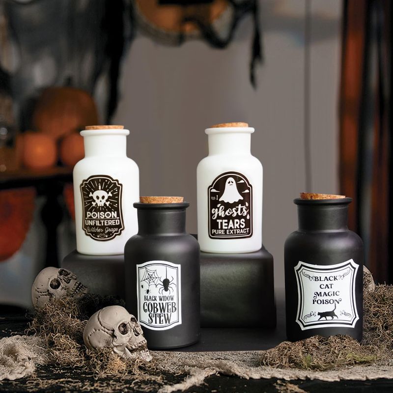 Photo 1 of AMeek Halloween Decorations Indoor, 4 Potion Bottles with Cork & Labels for Halloween Tiered Tray Decor, Black and White Glass Apothecary Bottles Halloween Decor for Home Mantle Table
