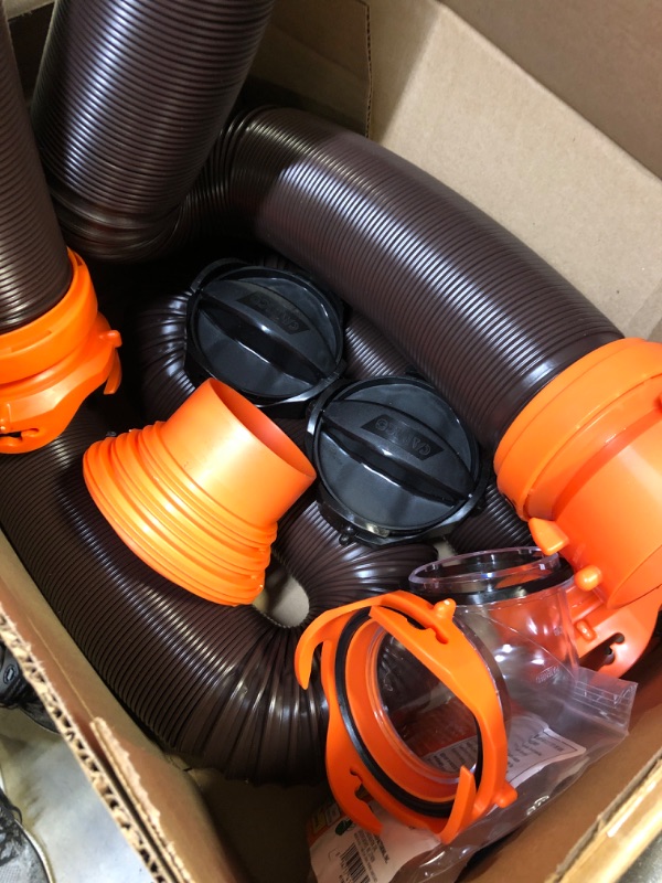 Photo 2 of Camco 20' (39742) RhinoFLEX 20-Foot RV Sewer Hose Kit, Swivel Transparent Elbow with 4-in-1 Dump Station Fitting-Storage Caps Included , Black , Brown 20ft Sewer Hose Kit Frustration-Free Packaging