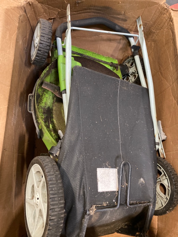 Photo 1 of Miscellaneous Used GreenWorks Lightweight Lawn Mower Trimmer/ Model/ Make Unkown- ITEM IS USED AND DIRTY