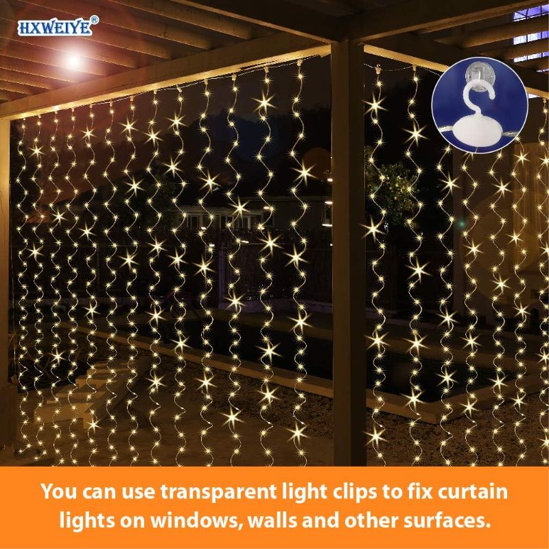 Photo 3 of HXWEIYE 300LED Fairy Curtain Lights, 9.8x9.8Ft Warm White USB Plug in 8 Modes Christmas String Hanging Lights with Remote for Bedroom, Indoor, Outdoor, Weddings, Party

