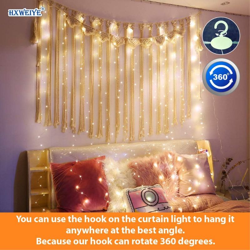 Photo 2 of HXWEIYE 300LED Fairy Curtain Lights, 9.8x9.8Ft Warm White USB Plug in 8 Modes Christmas String Hanging Lights with Remote for Bedroom, Indoor, Outdoor, Weddings, Party

