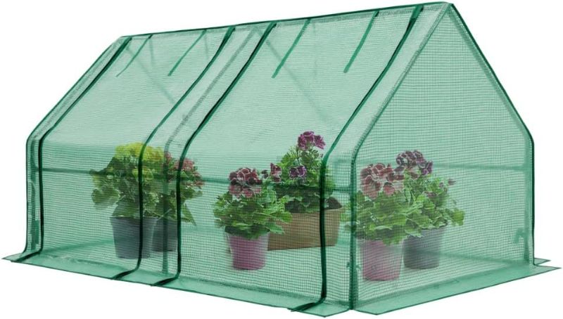 Photo 1 of Mini Greenhouse, Portable Indoor & Outdoor Garden Green House with 2 Roll-Up Zipper Doors, Clear/Green PE Cover NEW