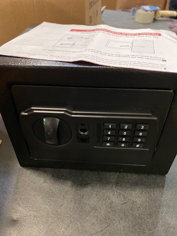 Photo 3 of Fireproof Small Safe Box for Money, 0.23 Cu ft Mini Fireproof Safe with Combination Lock, Digital Safe for Kids Home Hotels Business (17sp-black-1) UNABLE TO OPEN, MISSING KEY 
