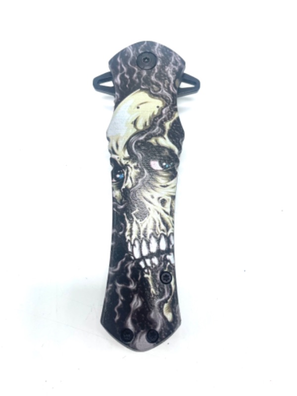 Photo 1 of 4.63" Spear Point Cross Style Spring Assisted Folding Pocket Knife -Skull With Smoke Detail