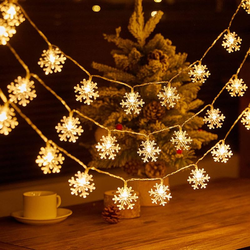 Photo 1 of Miscellaneous Bundle: Christmas Snowflake Lights Decorations, 32.8 ft 80 LED Battery powered indoor and outdoor Christmas lights , for Xmas Garden Patio Outdoor Bedroom Party Decor Xmas Tree(Snowflake-Warm White) + Mini Cable Clips 3M Adhesive, Multipurpo